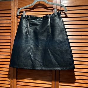 ZARA faux leather black skirt with zippers. A line cut. Size Medium.